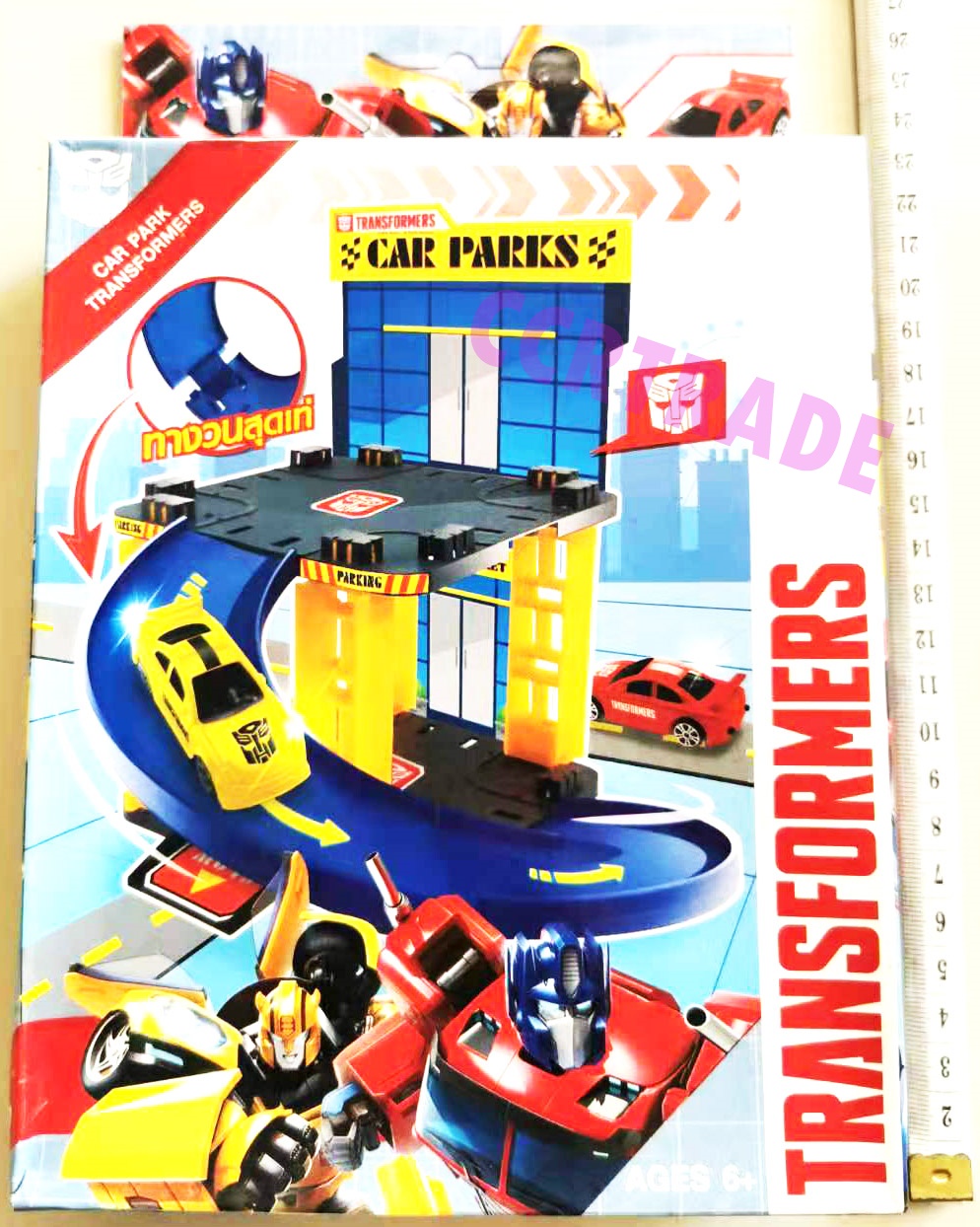 ตึกจอดรถทรานฟอร์เมอร์+ รถแข่ง 2 คันกล่อง 16x25 ซม.(ลิขสิทธิ์แท้)(1x6)