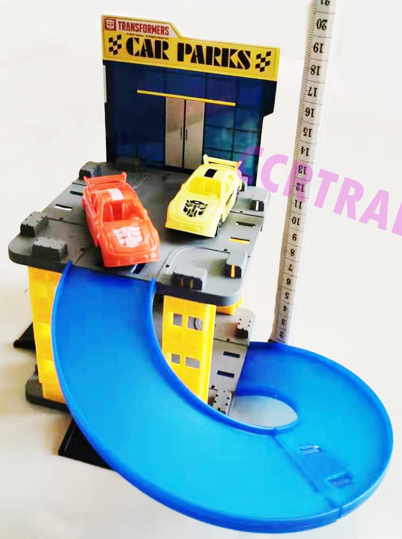 ตึกจอดรถทรานฟอร์เมอร์+ รถแข่ง 2 คันกล่อง 16x25 ซม.(ลิขสิทธิ์แท้)(1x6)
