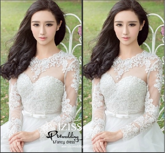 ฺBRL004 **พรีออเดอร์**ชุดแต่งงานสีขาวแขนยาวซีทรูช่วงอกสวยหวาน ประดับลูกไม้ลวดลายหรูหรา พร้อมเข็มขัดรูปโบว์ ต่อด้วยกระโปรงบานฟรุ้งฟริ้ง สวยงามดุจเจ้าหญิง