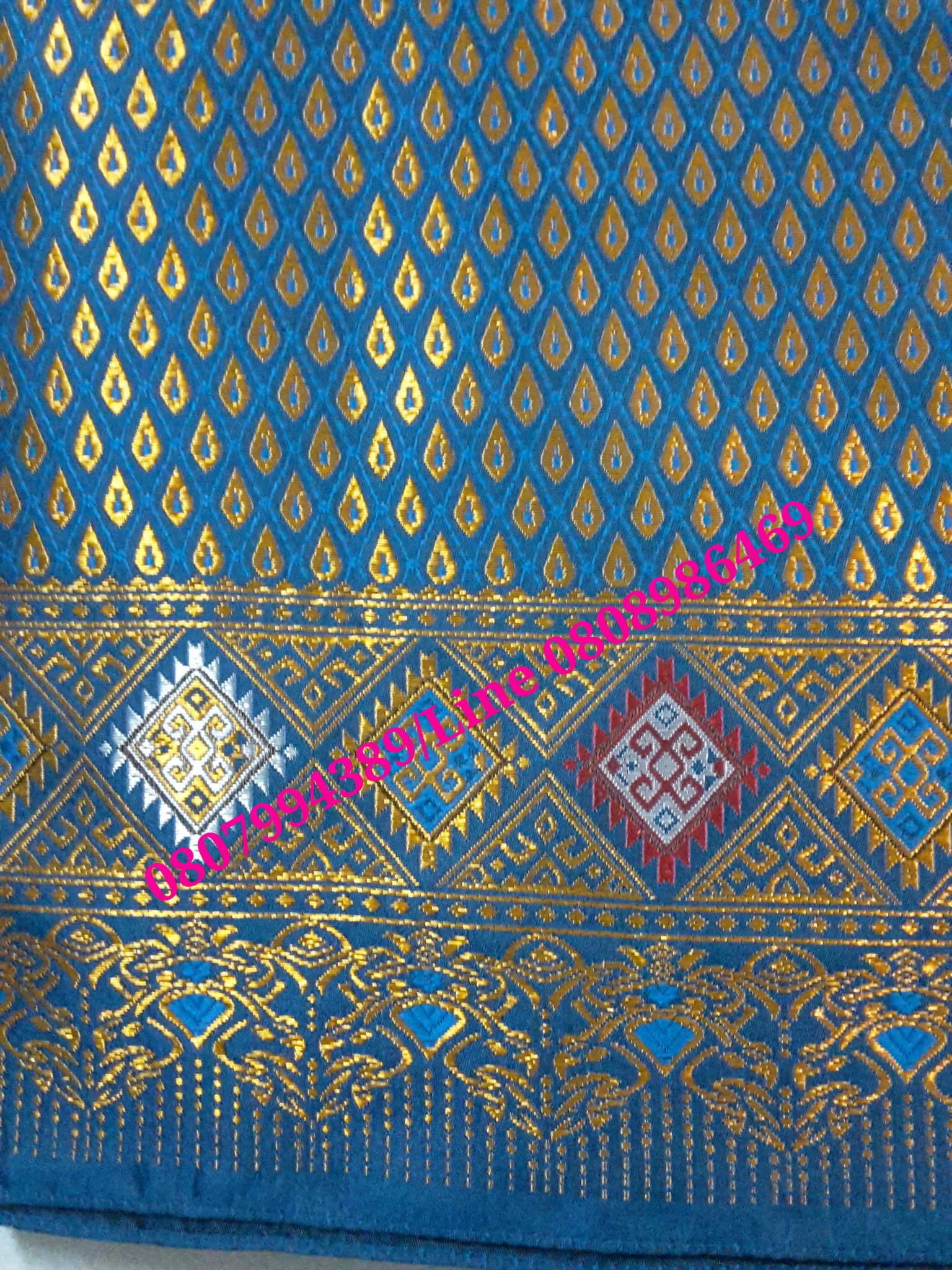 ผ้าซิ่นสำเร็จรูปผ้าซิ่นลาวแบบป้ายเลื่อนตะขอ ผ้าซิ่นตีนจกไหมลาวสีฟ้าเมทอลลิค