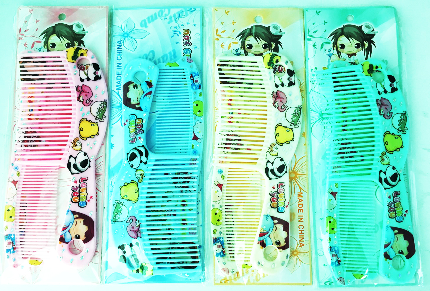 หวีอีโต้การ์ตูนสีหวาน 2 ชิ้นแผง 26.5 ซม.